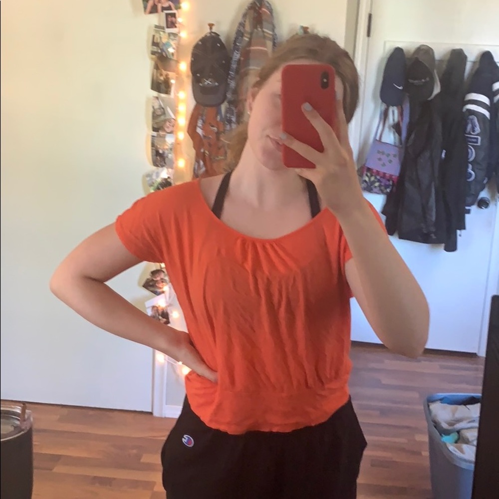Coral colored shirt with open back